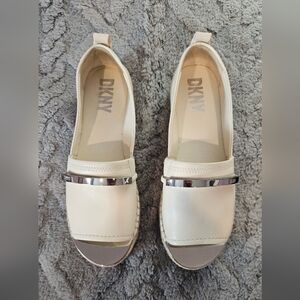 DKNY Cream Slip-On Loafers with Silver Band
